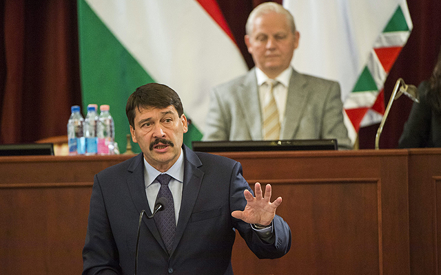 President János Áder delivers a speech at the meeting of Budapest General Assembly,  Mayor István Tarlós behind President Áder
