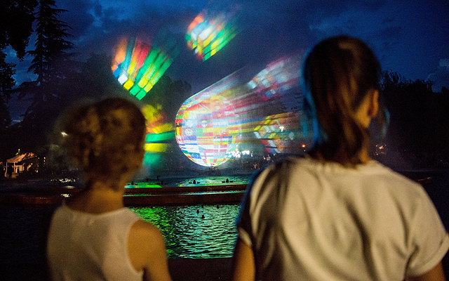 The animation projected on the water curtain can be seen as part of the music program 